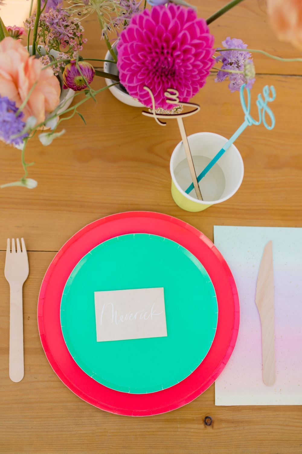 Colorful place settings for a backyard tie-dye party